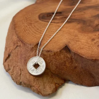 Pendentif pièce de monnaie